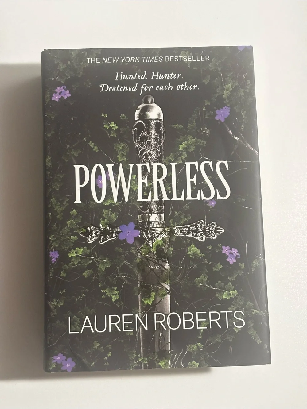 Powerless by Lauren Roberts - Black Cover with Purple Floral Accents
